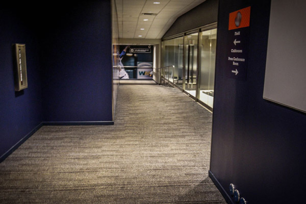 Carpet floor installation in a Houston corridor.
