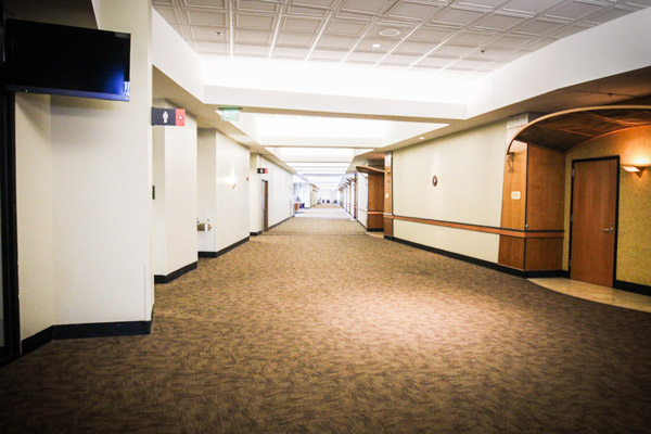 Carpet floor installation in a Houston suite corridor.