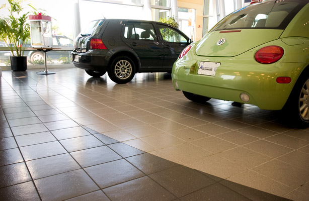 Ceramic tile floor installation in a Houston car dealership.