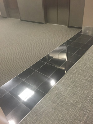 Carpet and tile floor installation in a Houston school.
